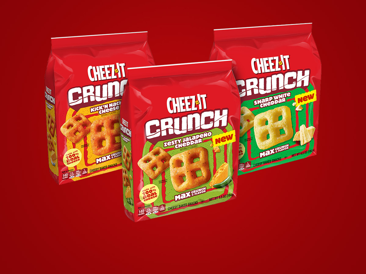 Three Cheez-It Crunch boxes on a red background